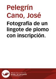 Fotografía de un lingote de plomo con inscripción.